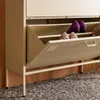 A close-up view of a metal shoe cabinet with its drawer open, revealing shoes inside. Produktbild-Vorschau