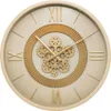 A close-up studio shot of a mechanical wall clock. Voir les images du produit