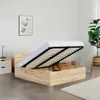 A bed frame with the mattress lifted to reveal storage space underneath. Produktbild-Vorschau
