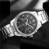 A close-up, studio shot of a men's Casio watch with a black dial and silver metal band, resting on a dark, textured surface. Produktbild-Vorschau