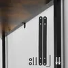 Close-up view of a shelf and its mounting hardware, including anti-tip straps and screws, against a white wall. Náhled obrázku produktu