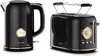 A black electric kettle and a black toaster with gold accents are displayed side-by-side against a white background. Podgląd zdjęcia produktu