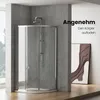 A modern bathroom with a glass shower enclosure, concrete walls, and a piece of abstract art. Anteprima dell’immagine prodotto