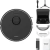 A black robot vacuum cleaner and its accessories are laid out on a white background. Náhled obrázku produktu