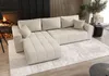 A modern living room with a fireplace, a sectional sofa, and a rug. Voir les images du produit