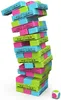 A tall, unstable tower of colorful wooden blocks with cartoon faces on them, next to a small die. Anteprima dell’immagine prodotto