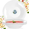 A stack of white soup bowls, one filled with tomato soup and garnished with a basil leaf. The background is white with decorative elements of pasta and tomatoes. Náhľad obrázku produktu
