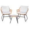 A rattan furniture set with two chairs and a small table, presented against a white background.
