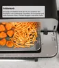 A close-up view of a pizza oven's interior with a mesh basket filled with french fries and chicken nuggets, along with a text overlay describing the 'Frittierkorb' (frying basket). Anteprima dell’immagine prodotto