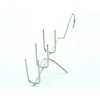A metal roasting rack with multiple prongs and a hook, isolated on a white background. Produktbild-Vorschau