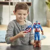A young boy is playing with a Captain America action figure and shield. Náhled obrázku produktu