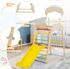 A children's indoor climbing frame with a slide, net, and ladder, set up in a room with a rug and furniture in the background. The image includes callouts highlighting product features. Náhled obrázku produktu