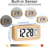 A digital alarm clock with a wooden frame, displaying time, date, temperature, and alarm settings. The image also includes smaller inset images showing the clock in different lighting conditions and its dimensions. Produktbild-Vorschau