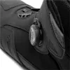 A close-up view of a black motorcycle boot, focusing on the BOA lacing system. Podgląd zdjęcia produktu