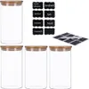 A set of four clear glass storage jars with bamboo lids and a sheet of chalkboard stickers with a chalk pen. Produktbild-Vorschau