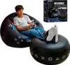 A young person is playing a video game while sitting on an inflatable gaming chair with an ottoman. Produktbild-Vorschau