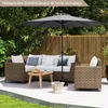 An outdoor patio set with a sofa, armchair, coffee table, and umbrella. Produktbild-Vorschau