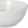 A close-up of a white bowl with ribbed detailing. Anteprima dell’immagine prodotto
