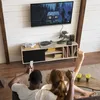 A couple is watching TV in a living room, with a TV box on a stand below the TV. Anteprima dell’immagine prodotto