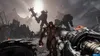 A first-person perspective of a video game scene, showing demons and a weapon. Produktbild-Vorschau