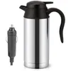 A stainless steel electric kettle with a black lid and handle, and a car charger plug. Náhled obrázku produktu
