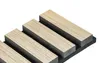 A close-up, angled view of acoustic panels with a wood-grain finish mounted on a dark backing. Podgląd zdjęcia produktu