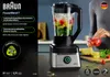 A person is adding strawberries to a blender filled with ingredients, with a pineapple and spinach on a cutting board nearby. Produktbild-Vorschau