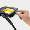 A hand is shown pressing a button on a pressure washer gun. Produktbild-Vorschau