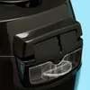 Close-up of a black appliance with a clear plastic handle or latch. Anteprima dell’immagine prodotto