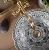 A close-up view of a decorative sink basin with a faucet. Anteprima dell’immagine prodotto