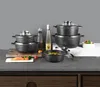 A collection of cookware and ingredients arranged on a kitchen counter. Náhled obrázku produktu