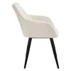 A side view of a cream-colored armchair with black metal legs, isolated on a white background. Produktbild-Vorschau