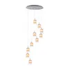 A multi-light pendant chandelier with glass shades hanging from a circular ceiling mount. Podgląd zdjęcia produktu