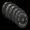 A set of black weight plates with white lettering, arranged diagonally. Produktbild-Vorschau
