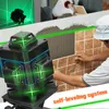 A person is tiling a wall with the help of a laser level. Náhled obrázku produktu