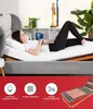 A woman is lying on an adjustable bed frame, using a laptop. The bottom part of the image contains marketing icons and text. Produktbild-Vorschau