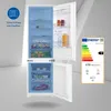 An open refrigerator with food items inside, next to an energy efficiency label. Produktbild-Vorschau