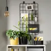 A desk setup with plants, a memo board, and office supplies. Náhled obrázku produktu