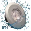 A close-up of a recessed LED spotlight with water splashing around it, indicating its water-resistant properties. The IP44 rating is prominently displayed. Produktbild-Vorschau