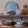 A set of stoneware dishes is displayed on two shelves against a gray background. Náhled obrázku produktu