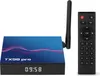 A smart TV box and its remote control are displayed against a white background. Podgląd zdjęcia produktu