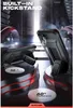 Two black phone cases with built-in kickstands are displayed on a reflective surface with red accents. The background is dark and industrial, with spotlights illuminating the cases. Produktbild-Vorschau