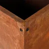 A close-up view of the corner of a rusted metal planter box, showing the rivets that hold it together. Produktbild-Vorschau