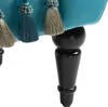 A close-up view of the bottom part of a teal upholstered bench, showing its black wooden legs and decorative tassels. Produktbild-Vorschau