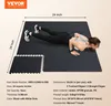 A woman is doing a push-up on a black interlocking floor mat. Náhled obrázku produktu