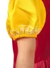 Close-up of a child's arm wearing a yellow puffed sleeve with a white floral pattern and a red garment underneath. Produktbild-Vorschau