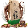 A bag of coffee beans with chocolate and hazelnuts, surrounded by splashes of milk and chocolate. Produktbild-Vorschau