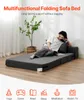 A woman is reading on a multifunctional folding sofa bed. Podgląd zdjęcia produktu