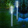 Two solar-powered garden lights with bubble effects are illuminated in a garden setting at dusk. Produktbild-Vorschau