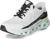 A white Skechers Glide-Step sneaker with black and mint green accents is shown from a side-front angle against a white background. Voir les images du produit